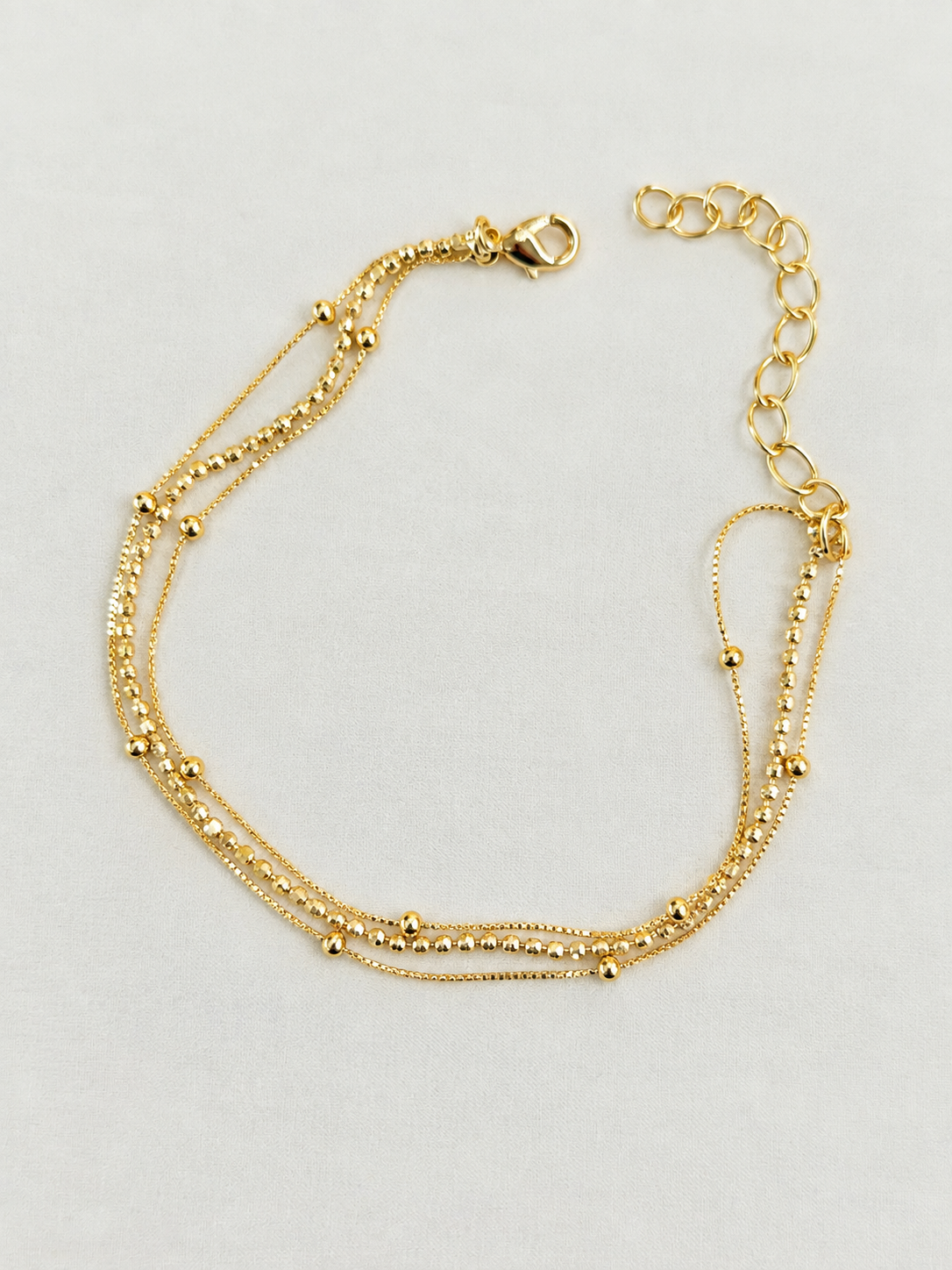 Pulseira tripla bolinhas