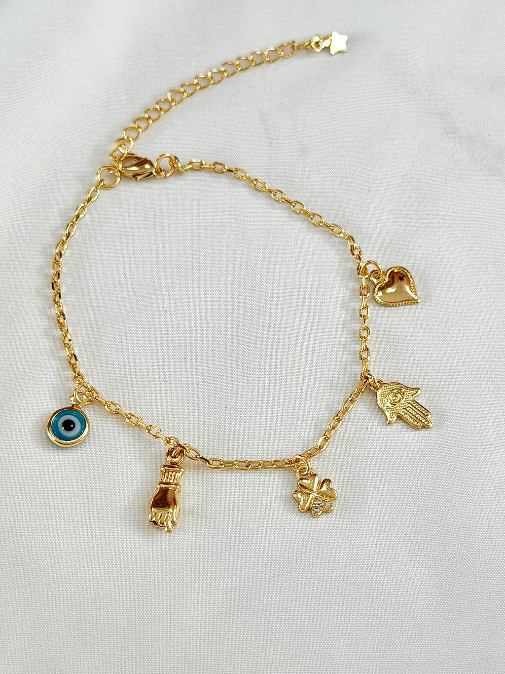 Pulseira mão de Fátima, figa e olho grego