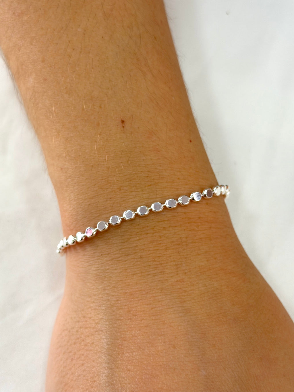 Pulseira bolinhas achatadas