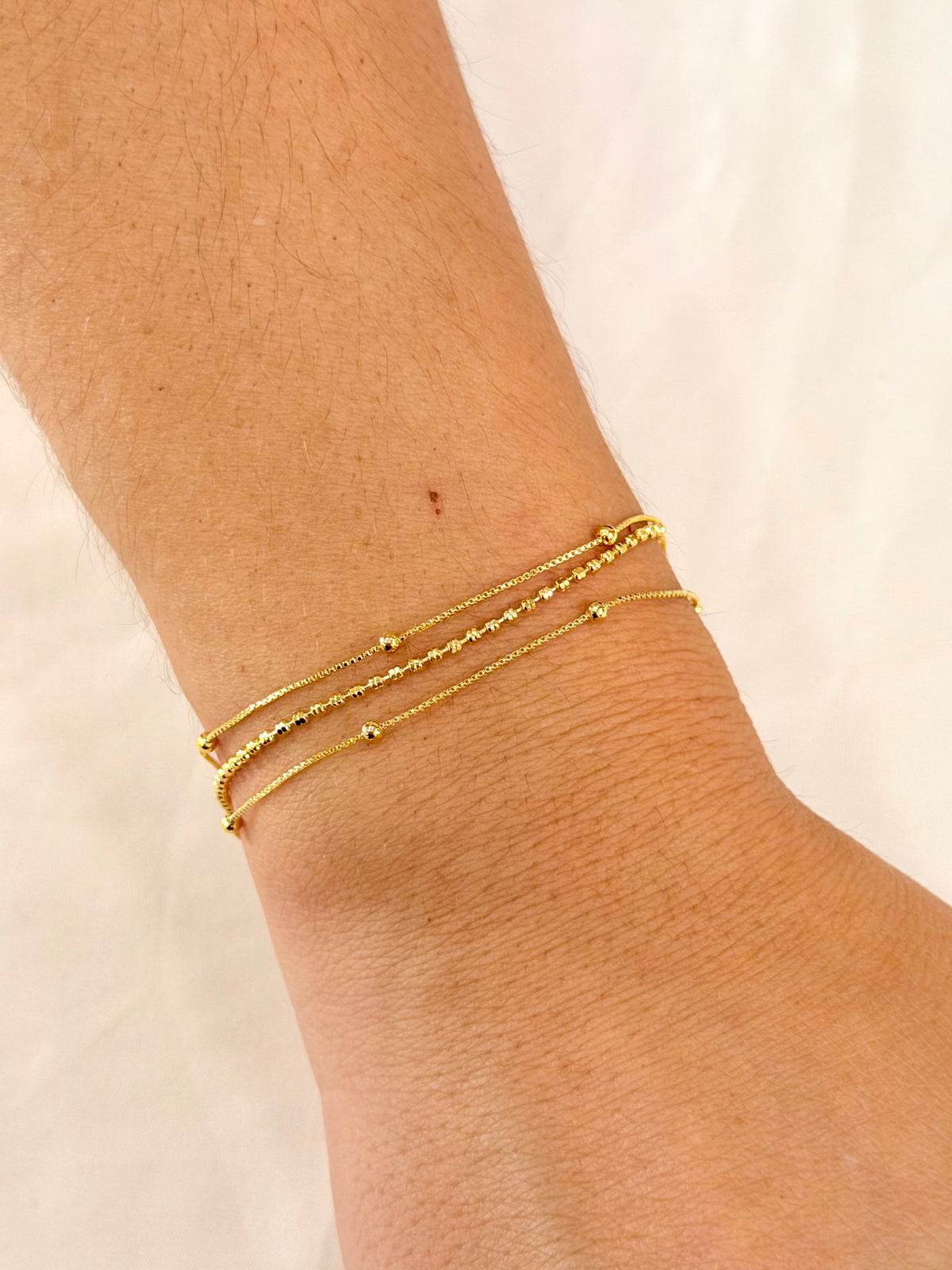 Pulseira tripla bolinhas