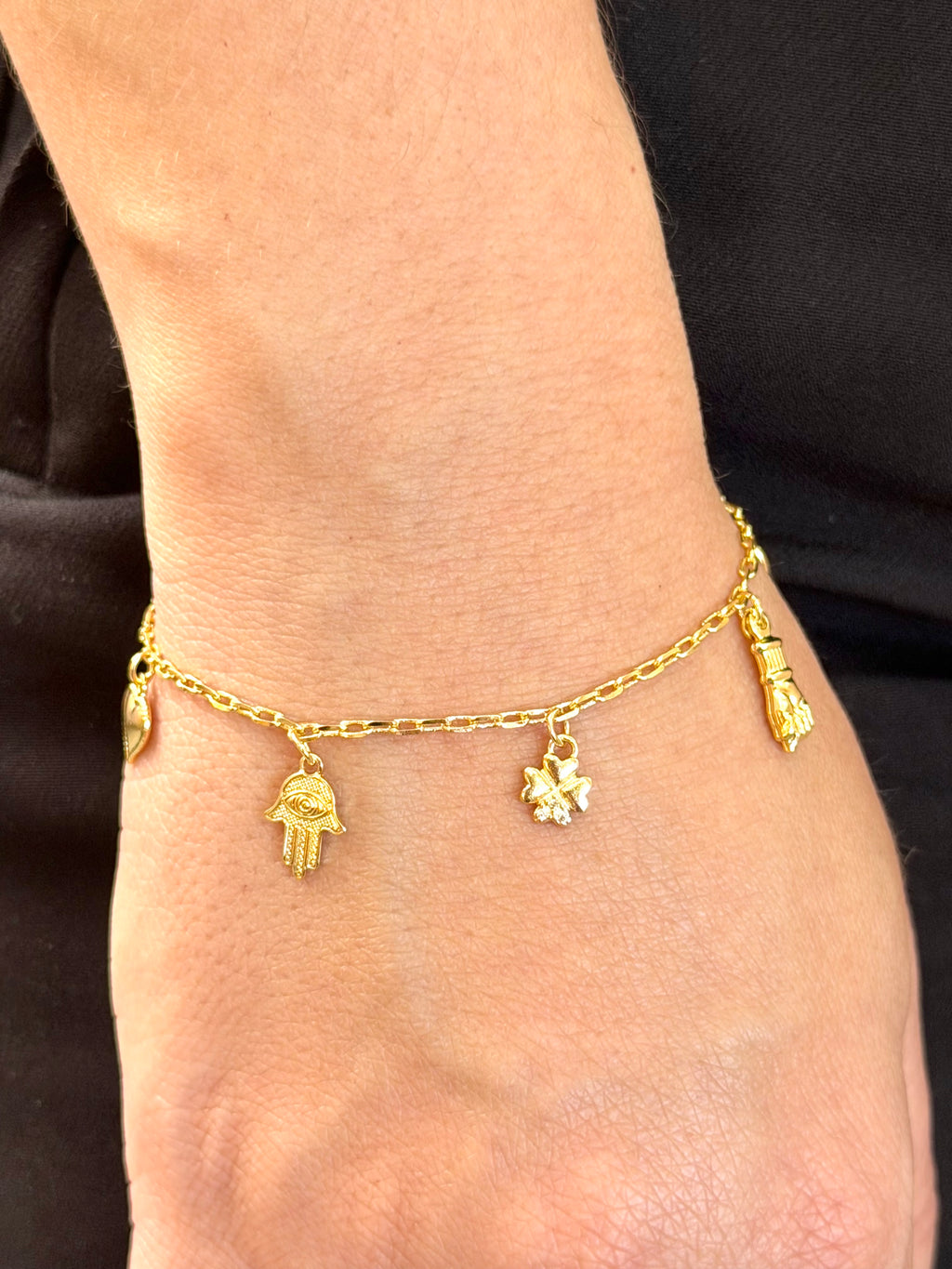 Pulseira mão de Fátima, figa e olho grego