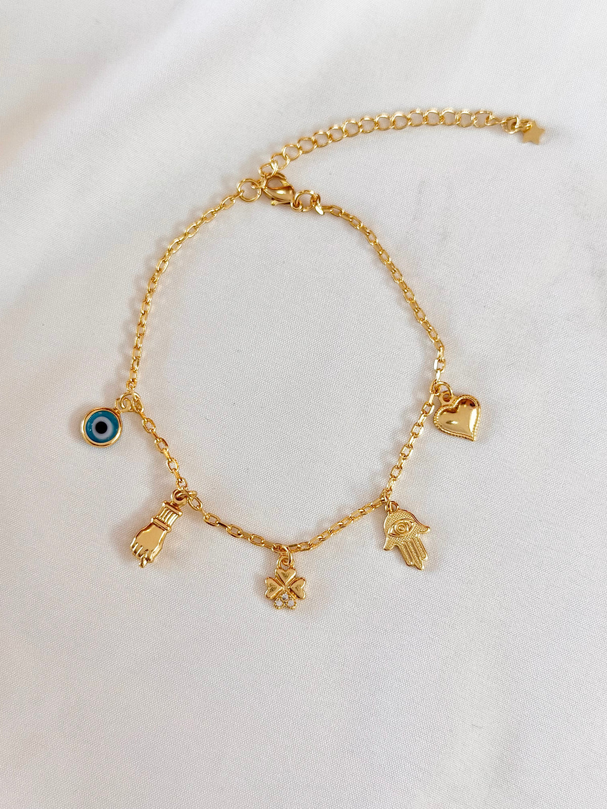Pulseira mão de Fátima, figa e olho grego