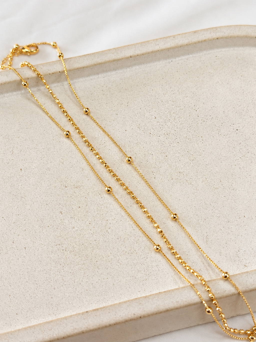 Pulseira tripla bolinhas