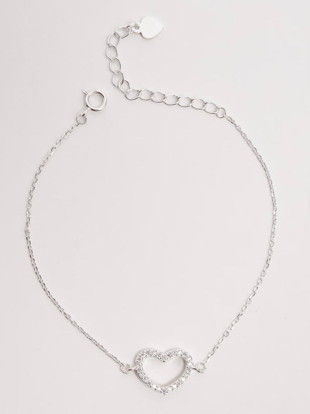 Pulseira entremeio coração vazado cravejado