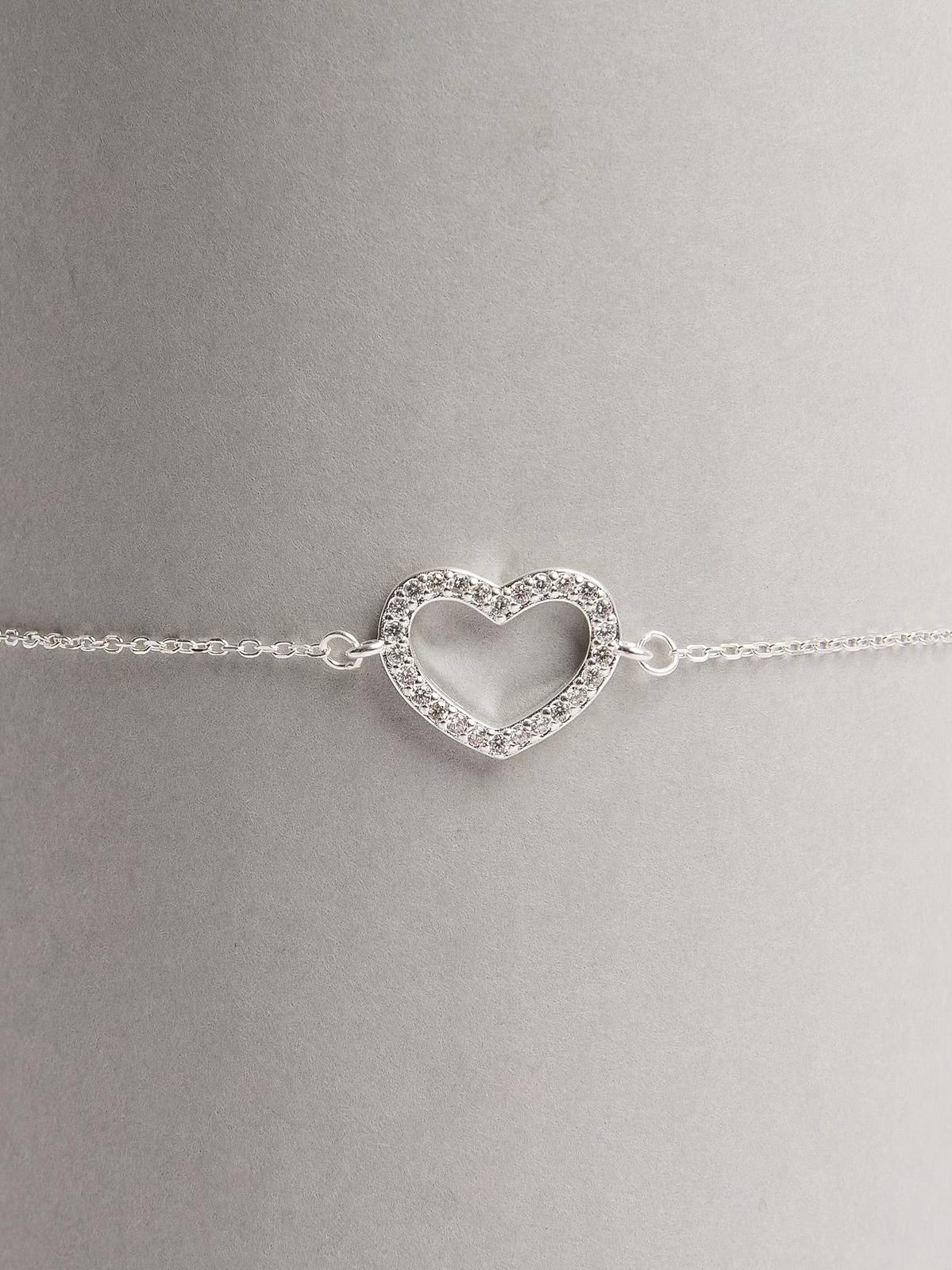 Pulseira entremeio coração vazado cravejado
